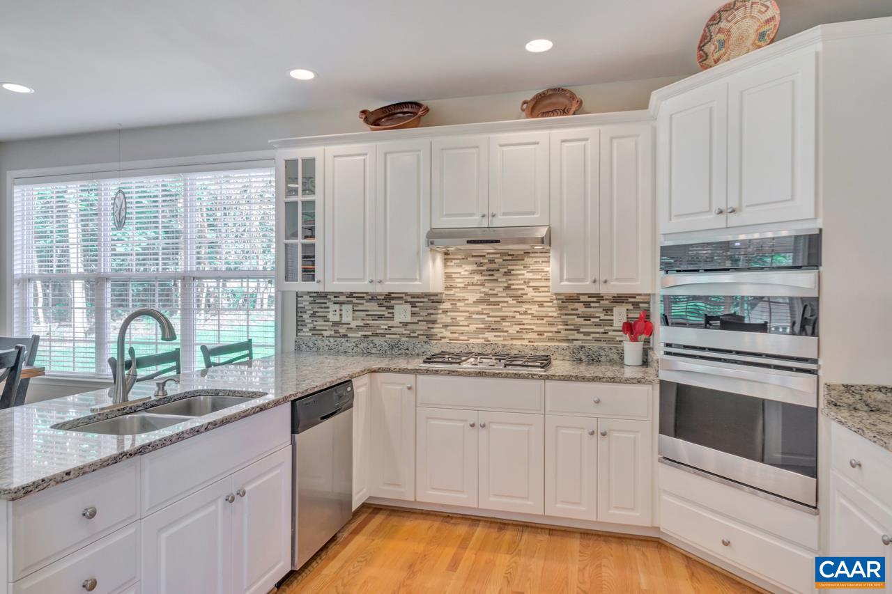 1915 Ridgetop Drive Charlottesville, VA 22903 - Photo 13 of 35 a kitchen with granite countertop white cabinets and white appliances