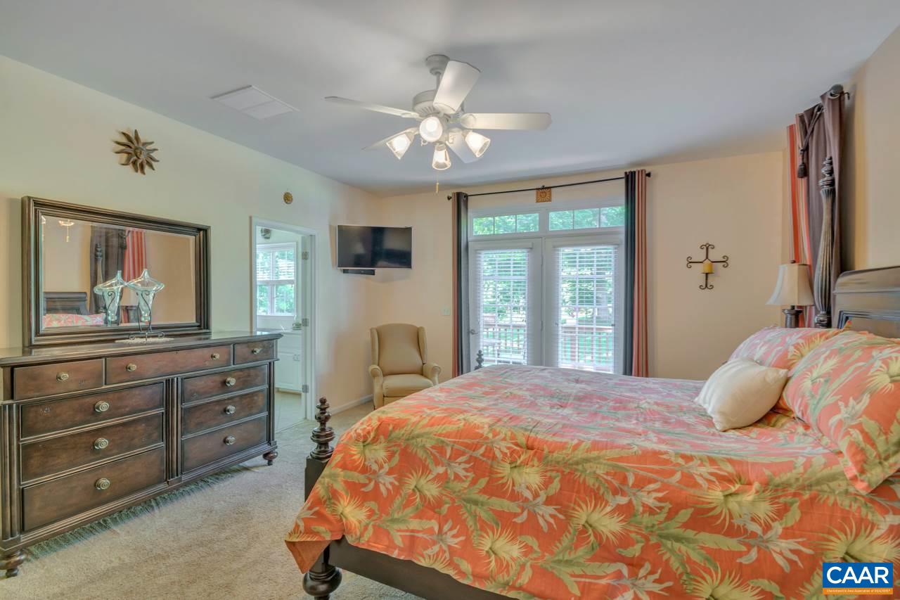 1915 Ridgetop Drive Charlottesville, VA 22903 - Photo 17 of 35 a bedroom with a large bed and a large mirror