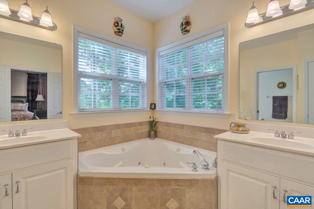 1915 Ridgetop Drive Charlottesville, VA 22903 - Photo 20 of 35 a bath tub sitting next to a bathroom sink