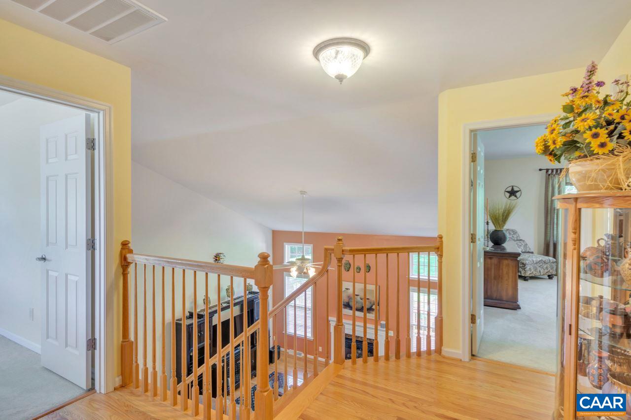 1915 Ridgetop Drive Charlottesville, VA 22903 - Photo 22 of 35 a view of hallway with livingroom and wooden floor