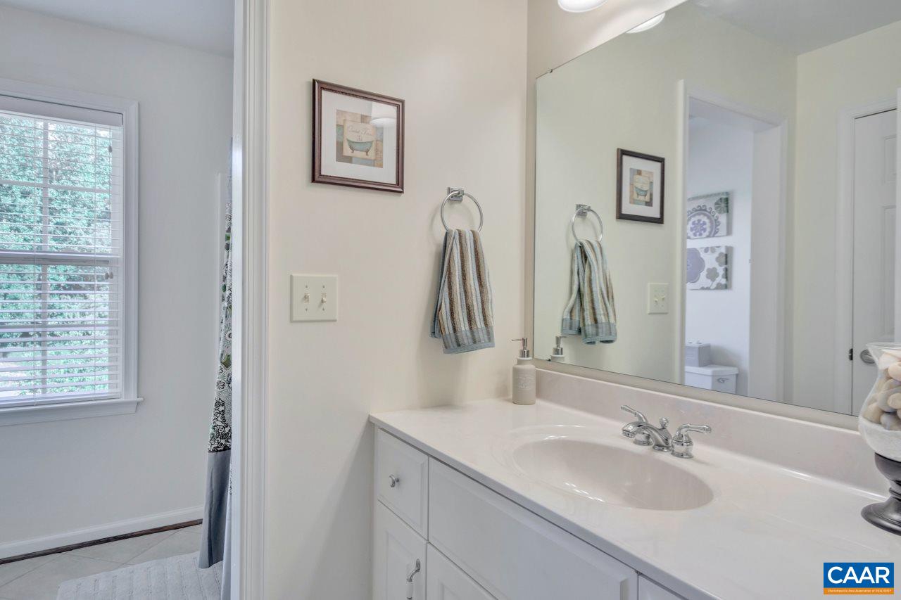 1915 Ridgetop Drive Charlottesville, VA 22903 - Photo 25 of 35 a bathroom with a sink vanity and a mirror
