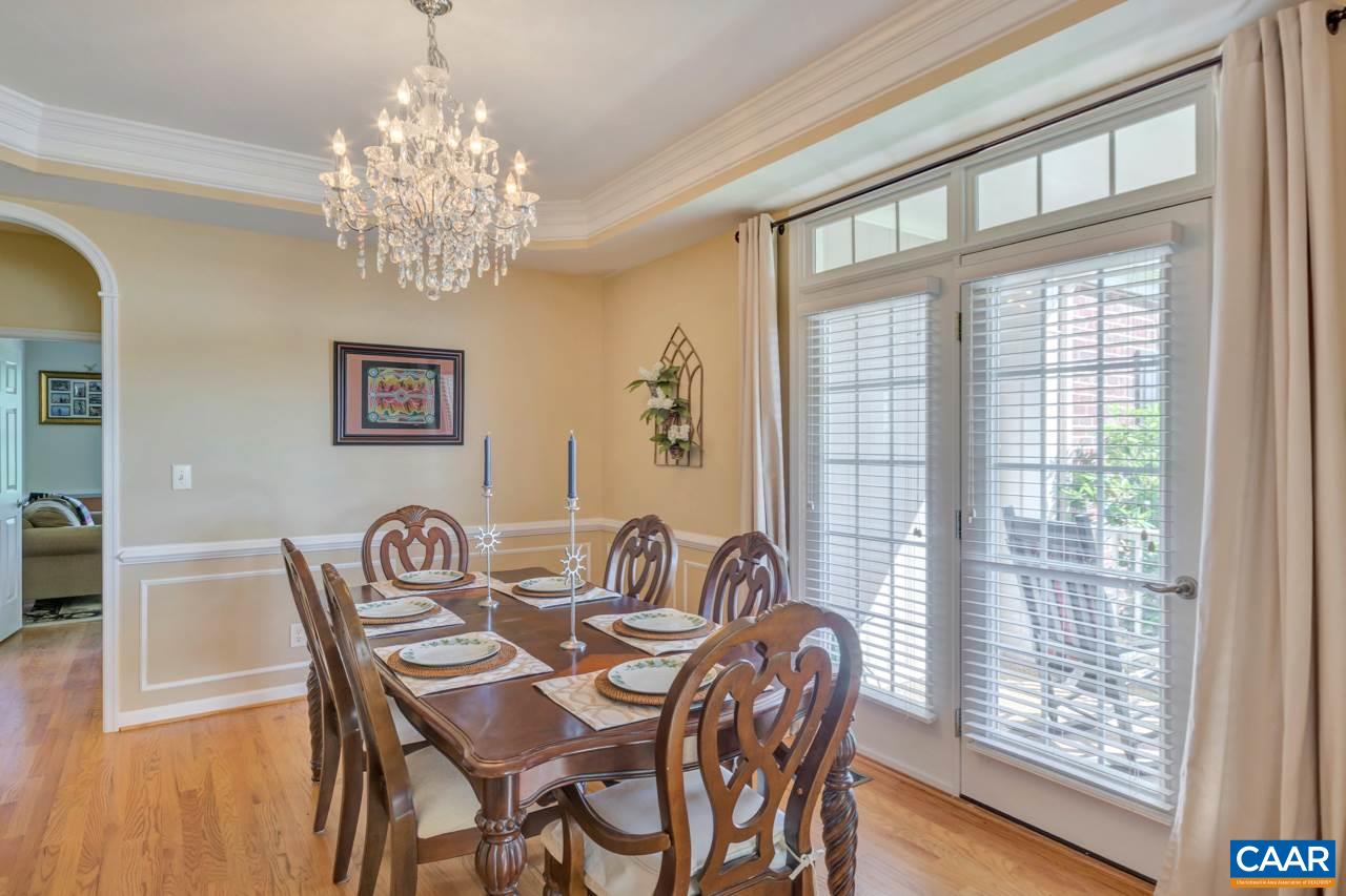 1915 Ridgetop Drive Charlottesville, VA 22903 - Photo 10 of 35 a view of a dining room with furniture wooden floor and chandelier