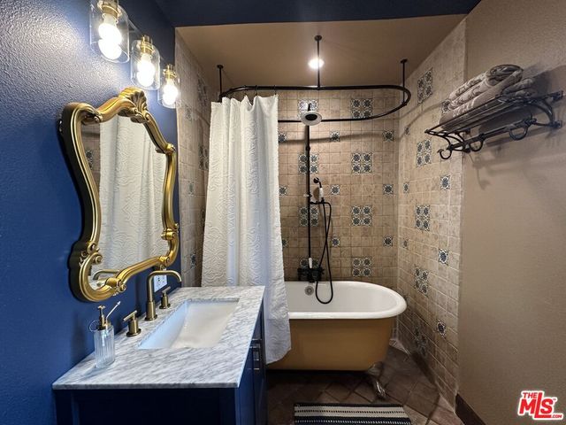 a bathroom with a sink and a mirror