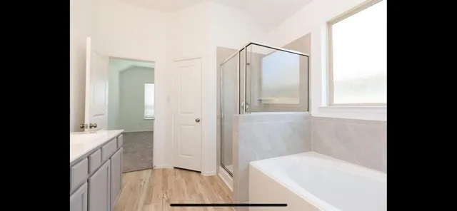 a bathroom with a sink vanity and a mirror