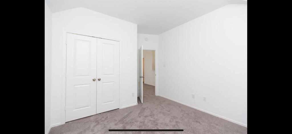 19044 Pinewood Grove Trail New Caney, TX 77357 - Photo 17 of 24 a view of an empty room