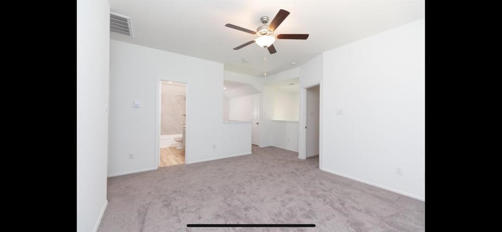 19044 Pinewood Grove Trail New Caney, TX 77357 - Photo 19 of 24 a view of a livingroom with a ceiling fan