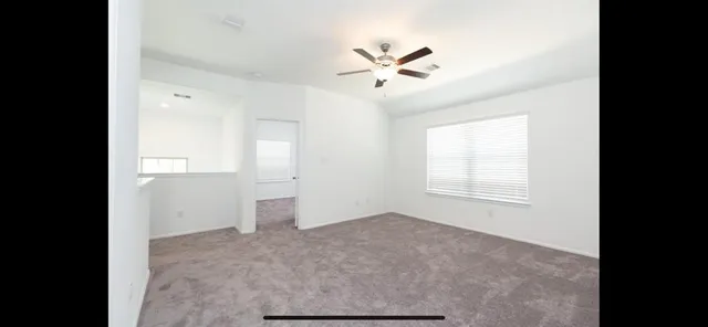 a view of a room with a hallway