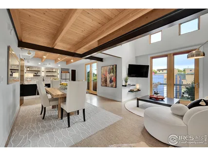 a living room with furniture and flat screen tv