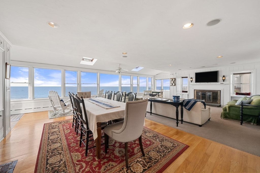 4 Priscilla Beach Road Plymouth, MA 02360 - Photo 12 of 34 a living room with furniture a fireplace and a flat screen tv