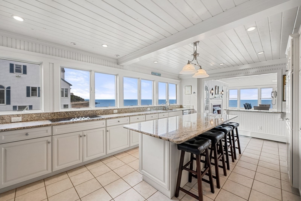 4 Priscilla Beach Road Plymouth, MA 02360 - Photo 14 of 34 a kitchen with center island table and chairs