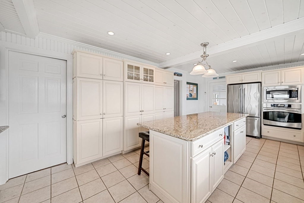 4 Priscilla Beach Road Plymouth, MA 02360 - Photo 15 of 34 a kitchen with granite countertop a sink and cabinets