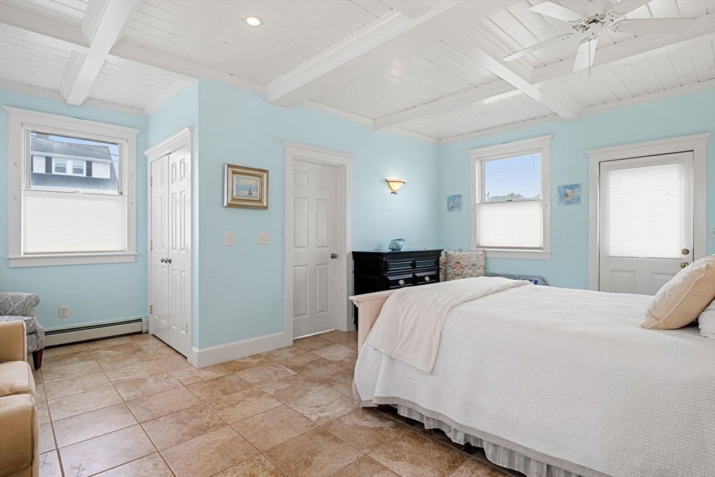 4 Priscilla Beach Road Plymouth, MA 02360 - Photo 21 of 34 a bedroom with a bed and a painting on the wall