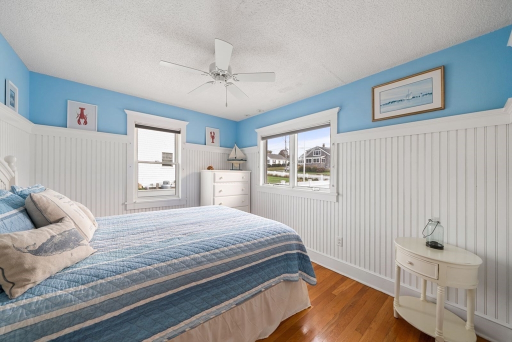 4 Priscilla Beach Road Plymouth, MA 02360 - Photo 24 of 34 a bedroom with a bed and wooden floor