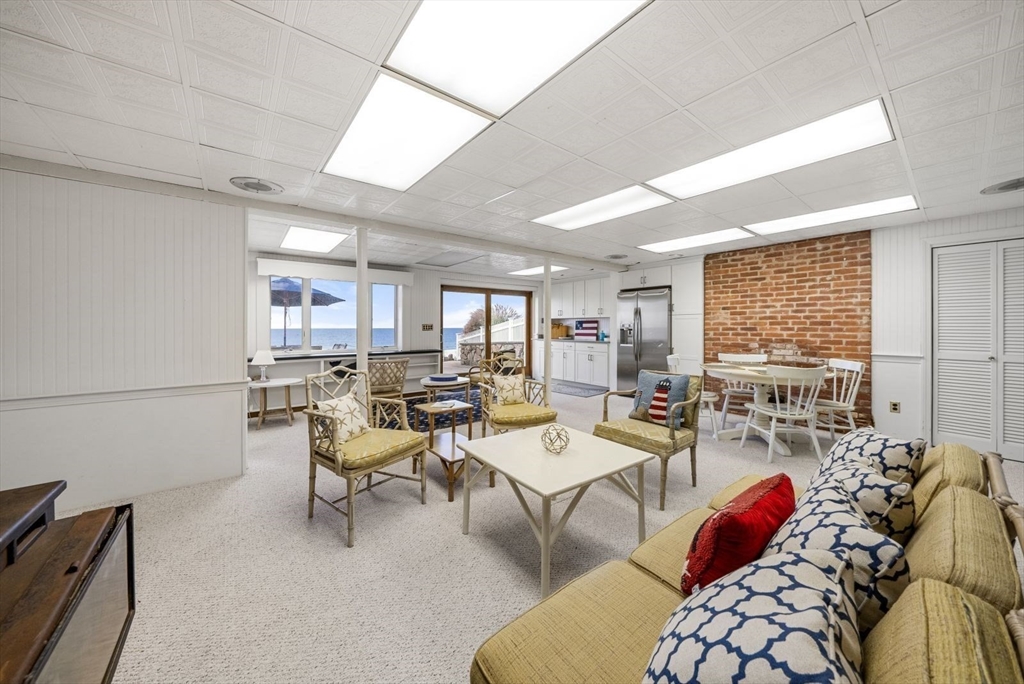4 Priscilla Beach Road Plymouth, MA 02360 - Photo 29 of 34 a living room with lots of furniture and a large window