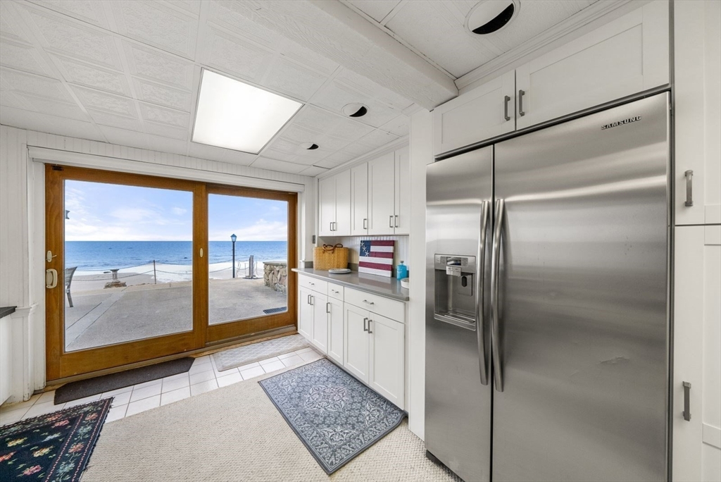 4 Priscilla Beach Road Plymouth, MA 02360 - Photo 30 of 34 a kitchen with a refrigerator a sink and a large window