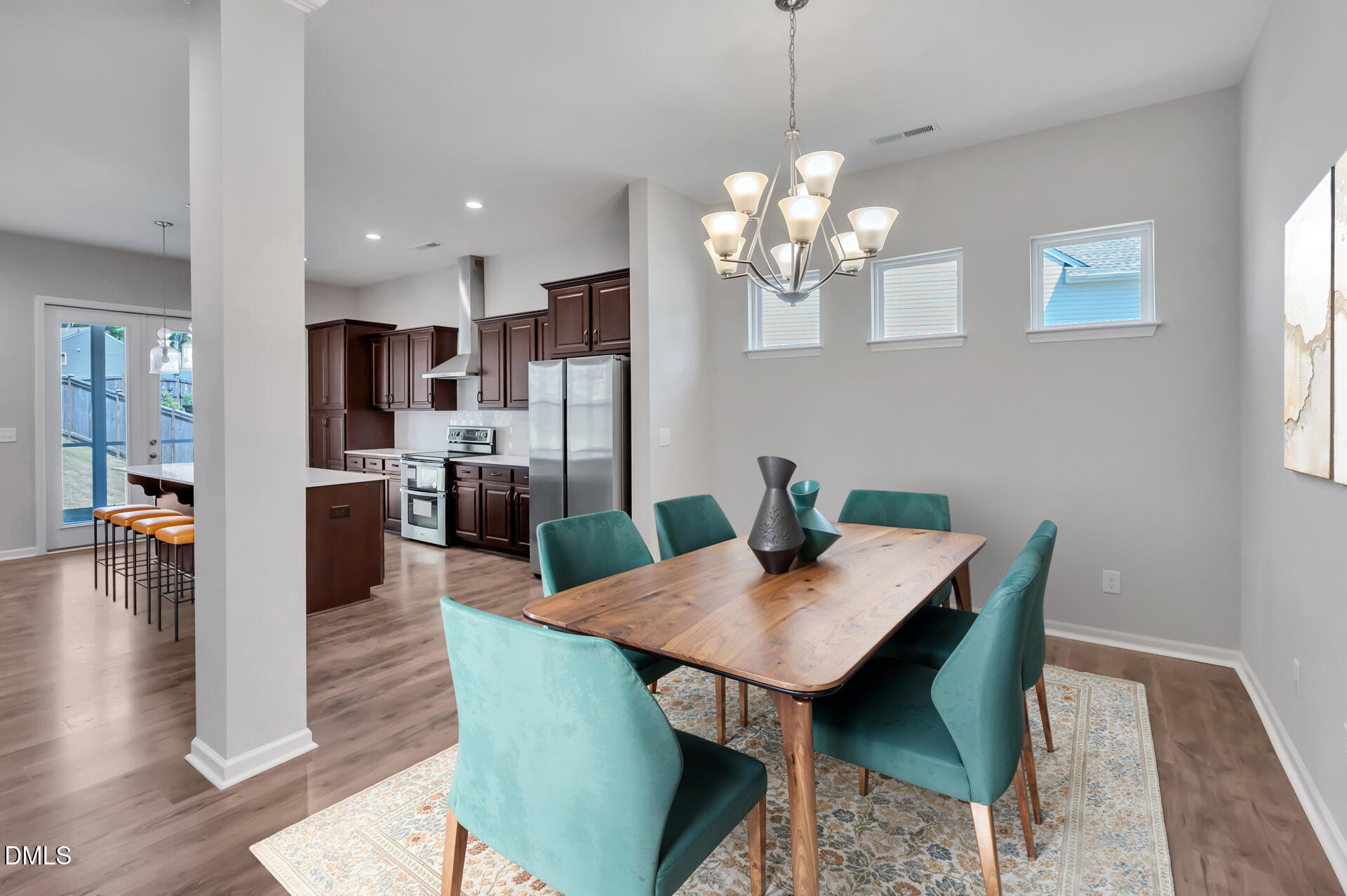 5406 Ripplebrook Drive Durham, NC 27712 - Photo 6 of 37 a view of a dining room with furniture and wooden floor