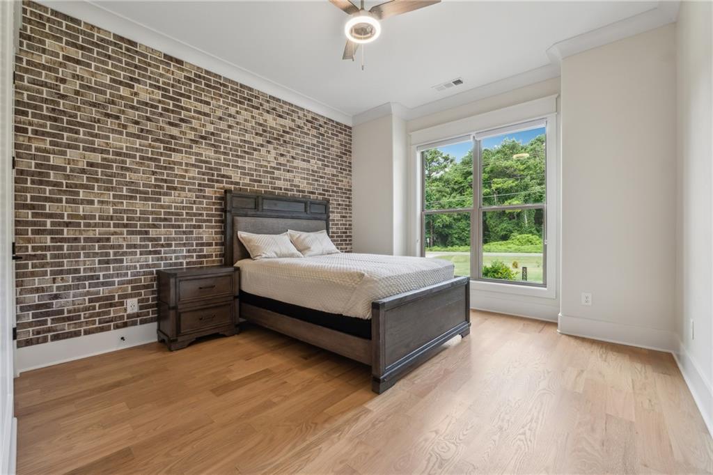 852 Tom Miller Road Bethlehem, GA 30620 - Photo 38 of 68 a bed sitting in a spacious bedroom next to a window