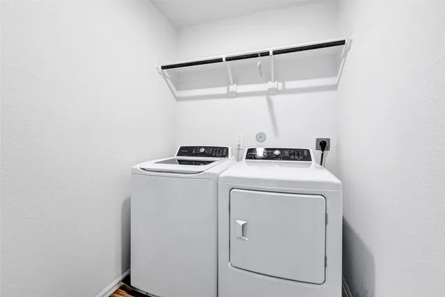 a utility room with dryer and washer
