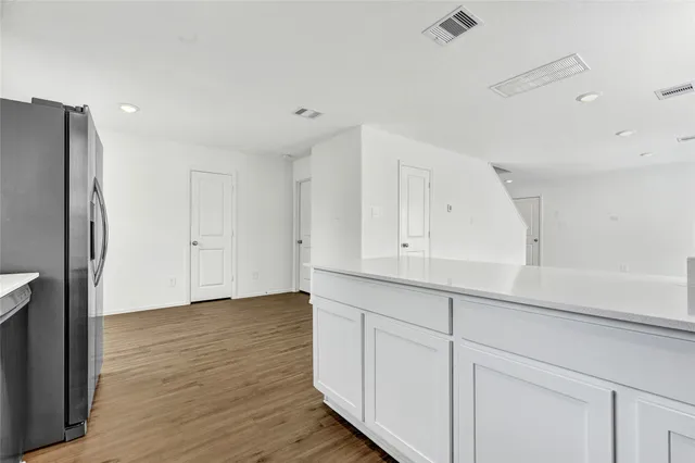 a view of cabinets with wooden floor