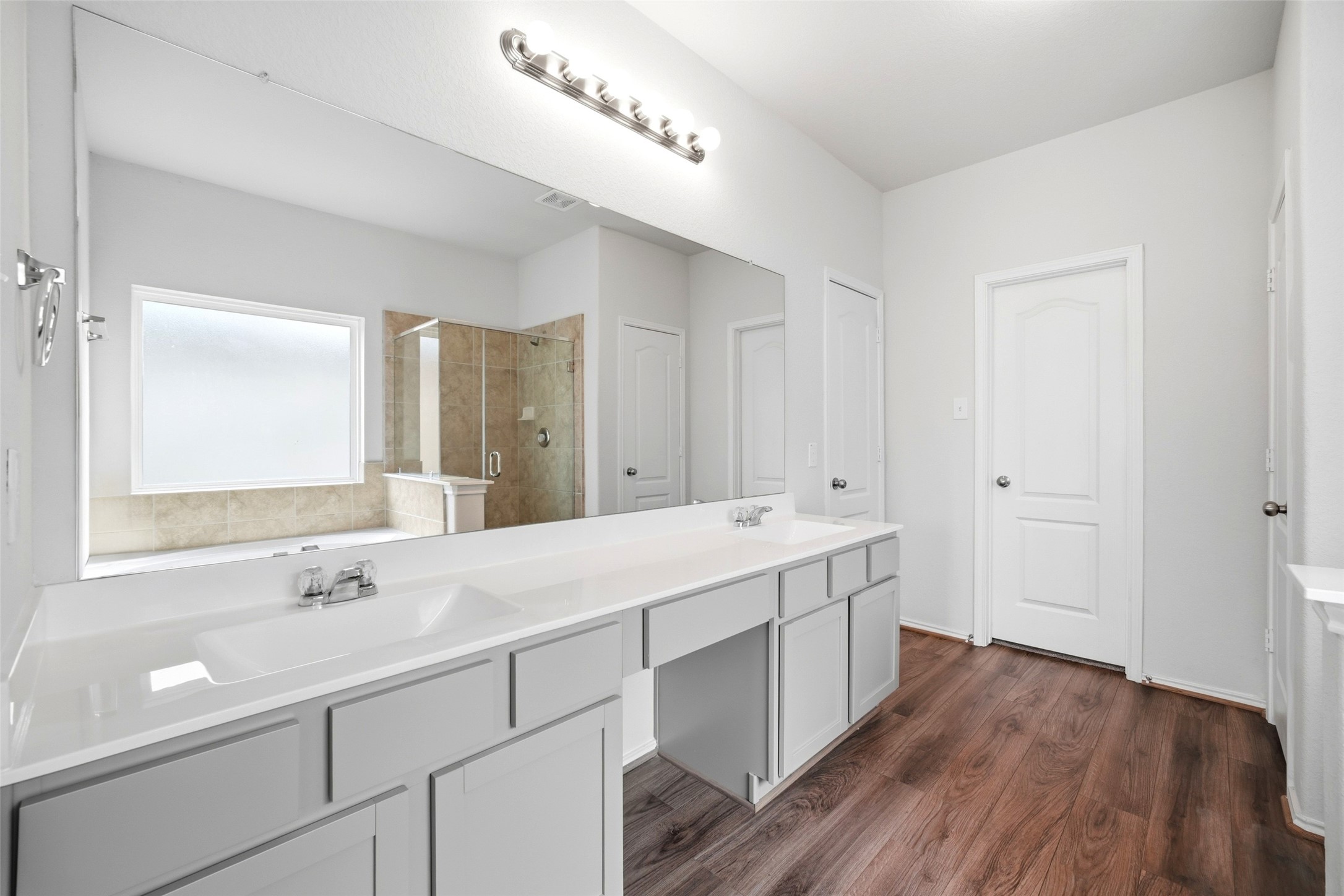 5309 Camerford Court Alvin, TX 77511 - Photo 25 of 29 a bathroom with a double vanity sink and mirror