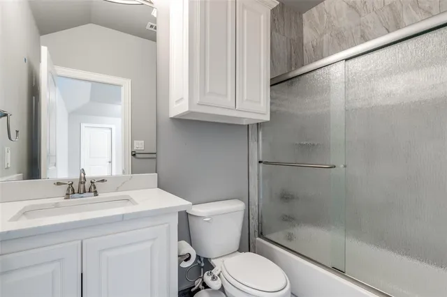 a bedroom with furniture and a wooden floor