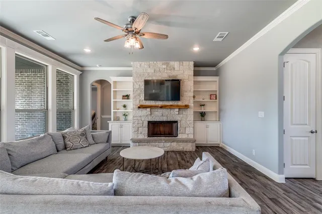a living room with furniture and a fireplace