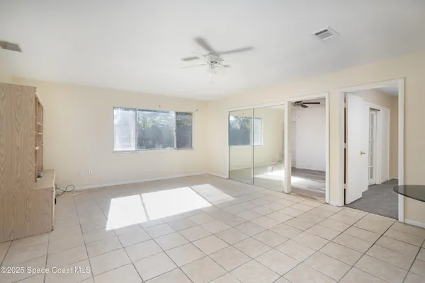 a view of an empty room and window