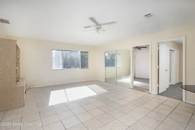 a view of an empty room and window