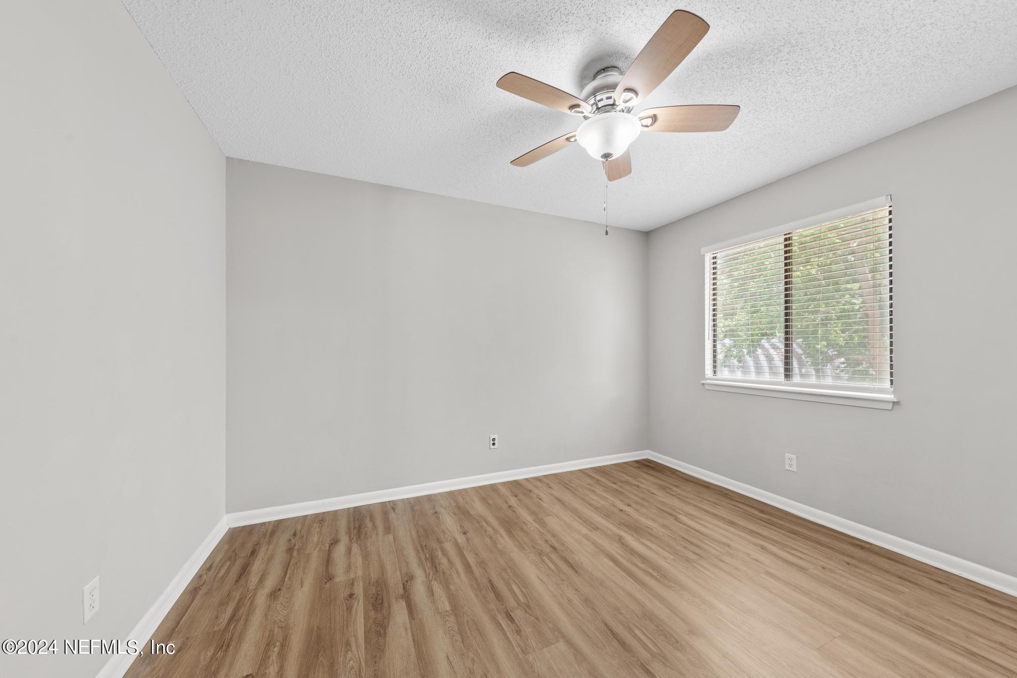 3604 Morton Street, Unit 2 Jacksonville, FL 32217 - Photo 11 of 22 wooden floor in an empty room with a window