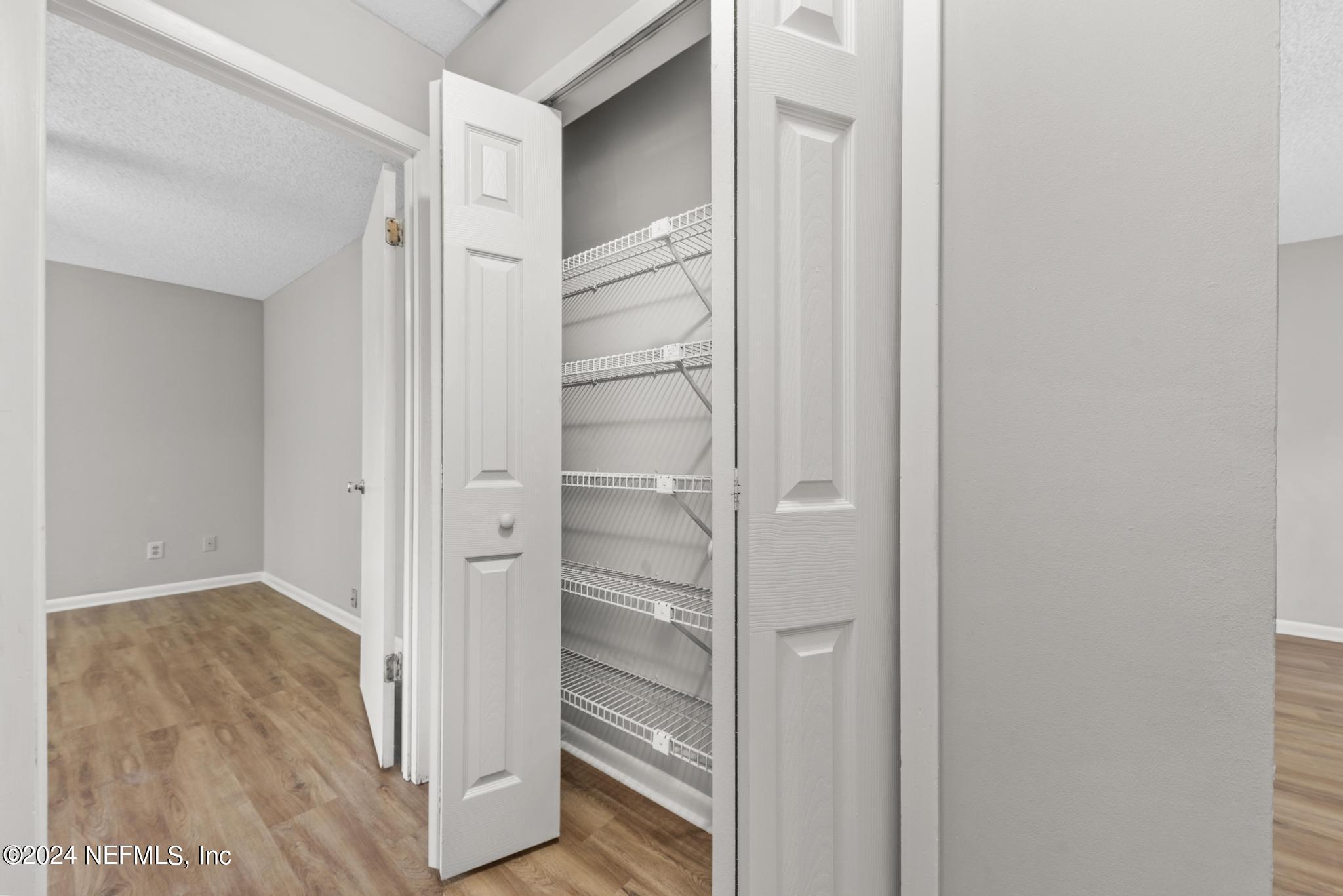 3604 Morton Street, Unit 2 Jacksonville, FL 32217 - Photo 14 of 22 a view of walk in closet with wooden floor