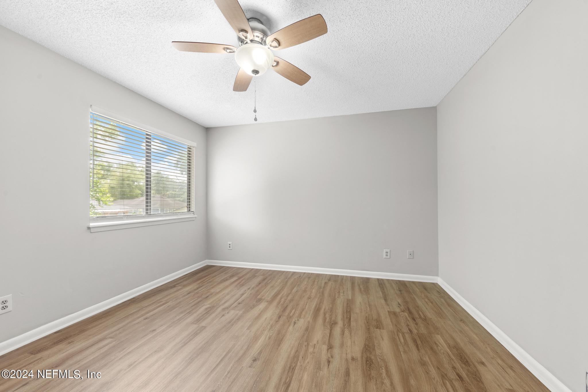 3604 Morton Street, Unit 2 Jacksonville, FL 32217 - Photo 15 of 22 wooden floor in an empty room with a window