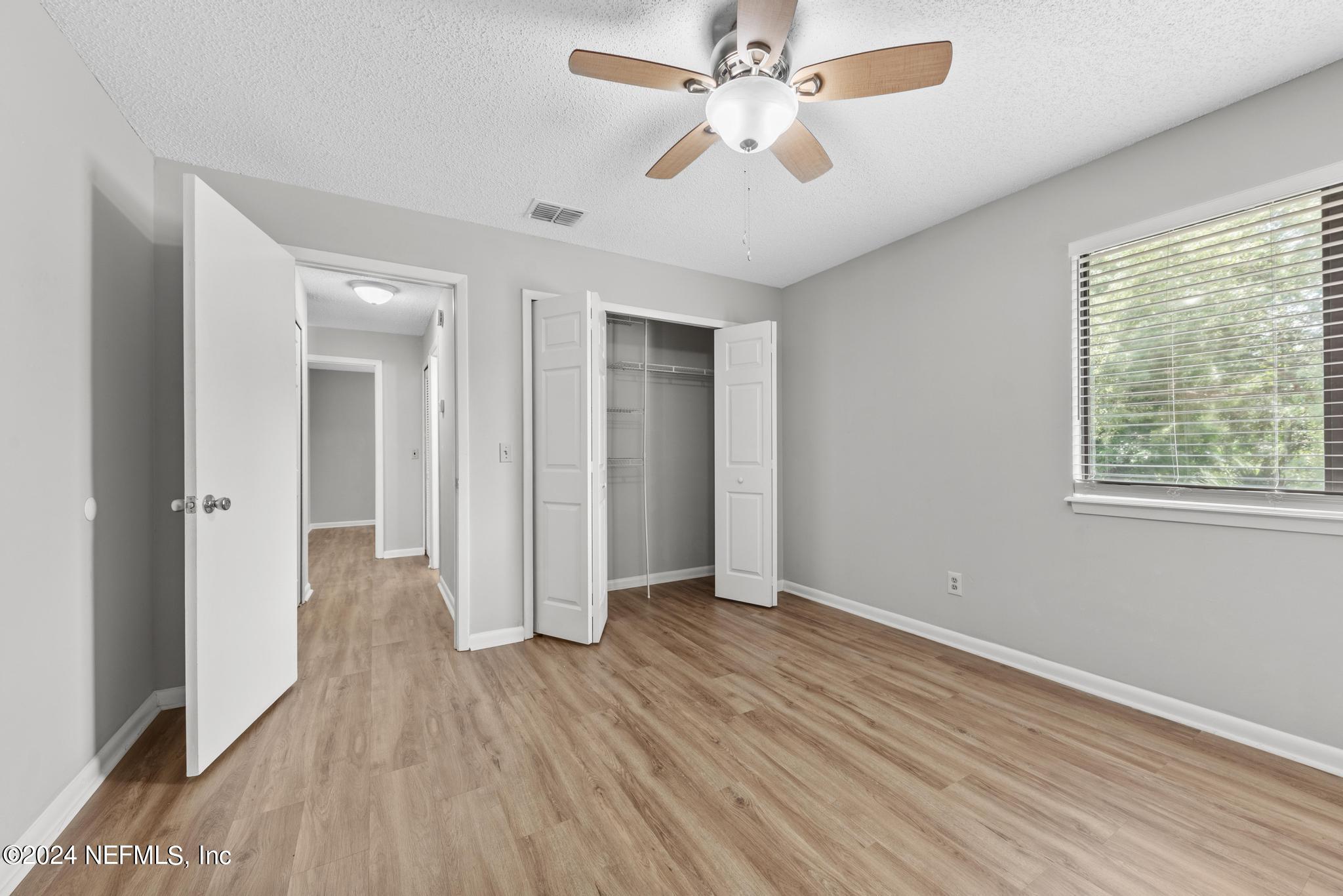 3604 Morton Street, Unit 2 Jacksonville, FL 32217 - Photo 16 of 22 wooden floor in an empty room with a window