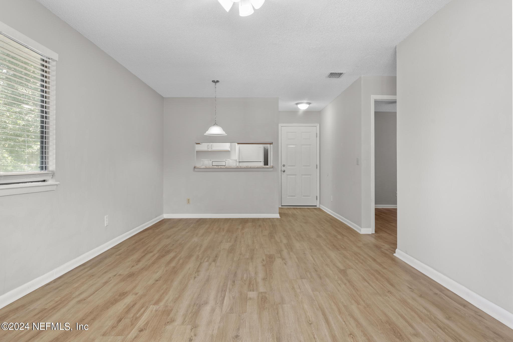 3604 Morton Street, Unit 2 Jacksonville, FL 32217 - Photo 17 of 22 wooden floor in an empty room with a window