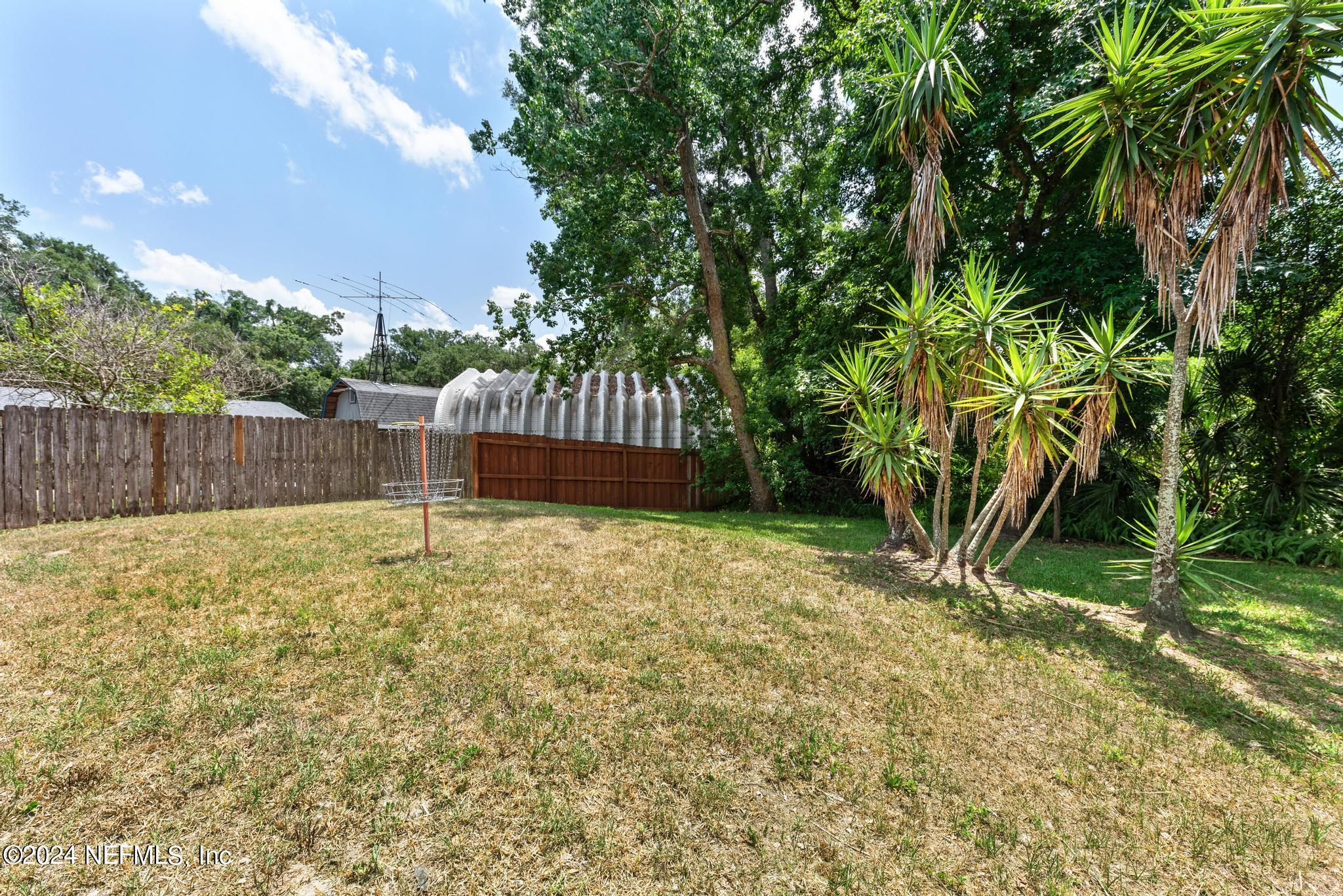 3604 Morton Street, Unit 2 Jacksonville, FL 32217 - Photo 20 of 22 a backyard of a house with lots of green space