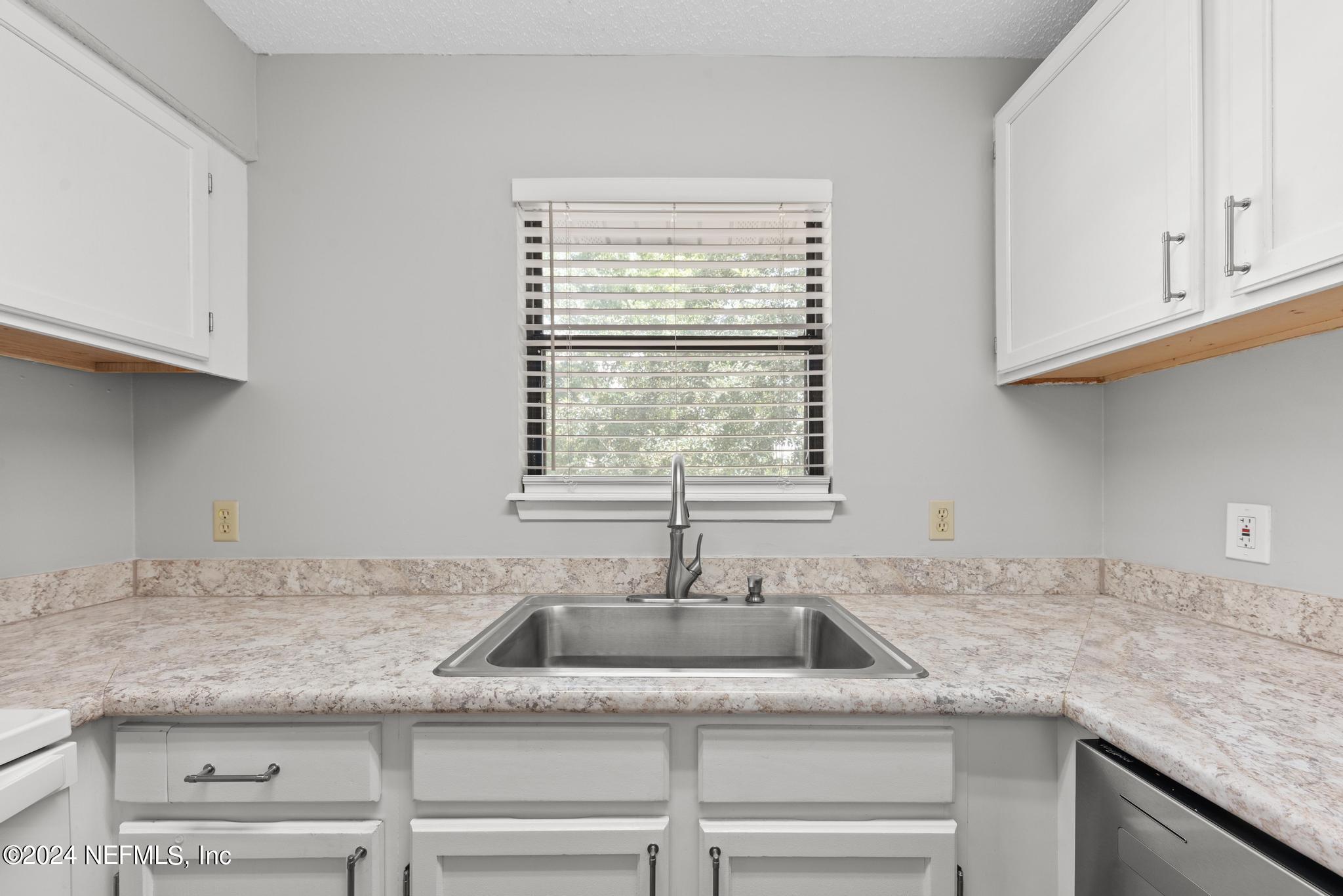 3604 Morton Street, Unit 2 Jacksonville, FL 32217 - Photo 6 of 22 a kitchen with granite countertop a sink and a window