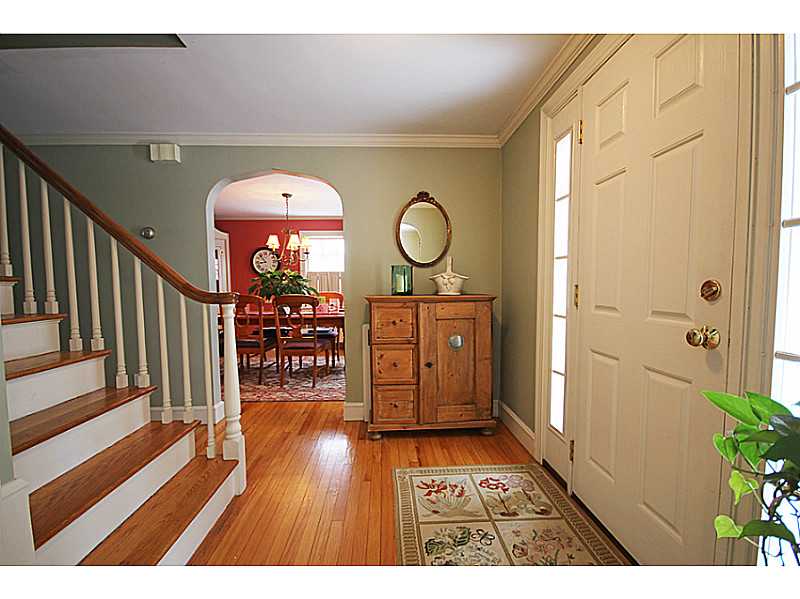 19 Surrey Road Barrington, RI 02806 - Photo 2 of 24 Entry. Charming entrance with Wide Staircase that leads up to the second level. Also notice the arched door way.