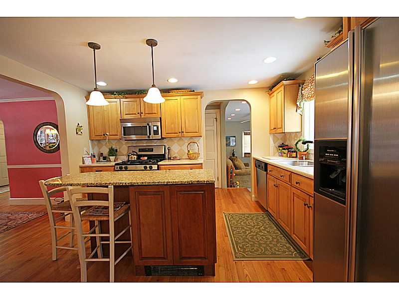 19 Surrey Road Barrington, RI 02806 - Photo 4 of 24 Kitchen. Stainless appliance and great flow into family room also opened to dining.