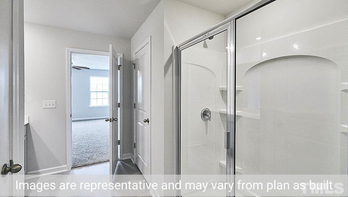278 Water Wheel Road Rocky Mount, NC 27803 - Photo 13 of 20 a bathroom with a shower and a glass door