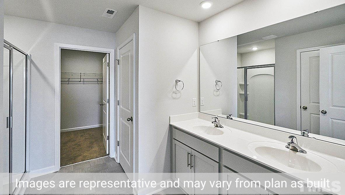 278 Water Wheel Road Rocky Mount, NC 27803 - Photo 15 of 20 a bathroom with a sink a toilet and shower