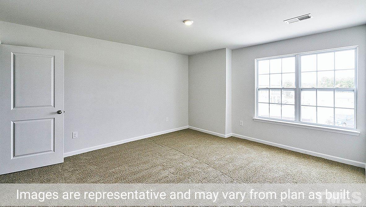 278 Water Wheel Road Rocky Mount, NC 27803 - Photo 17 of 20 an empty room with windows