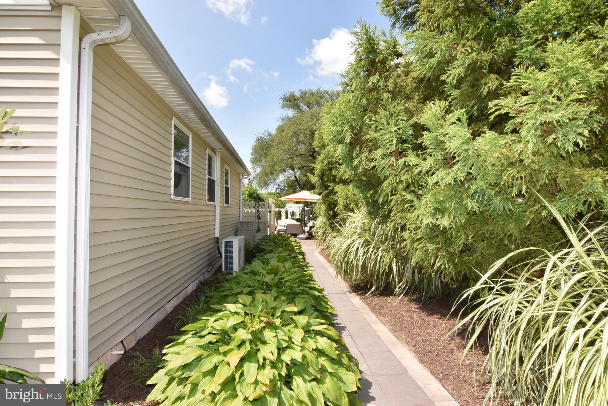 330 Behringer Avenue Milton, DE 19968 - Photo 25 of 49 Walkway to Back of Home