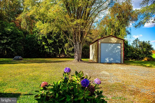 a front view of house with yard and swimming pool