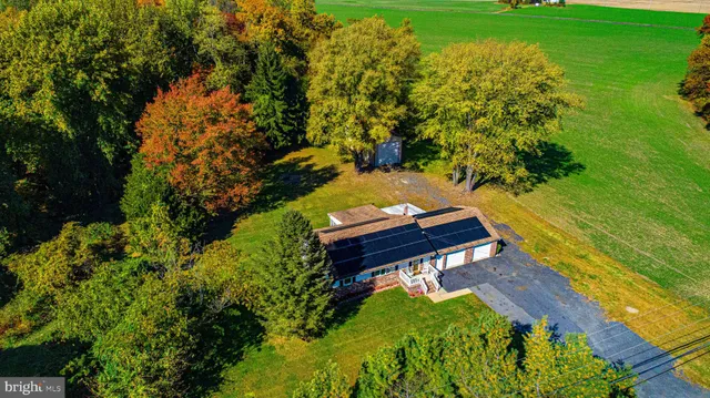 a view of a back yard of the wooden house