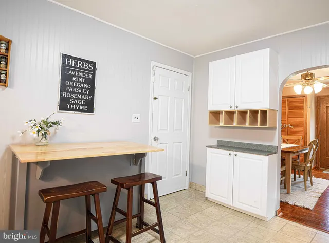a view of a dining room with furniture and window