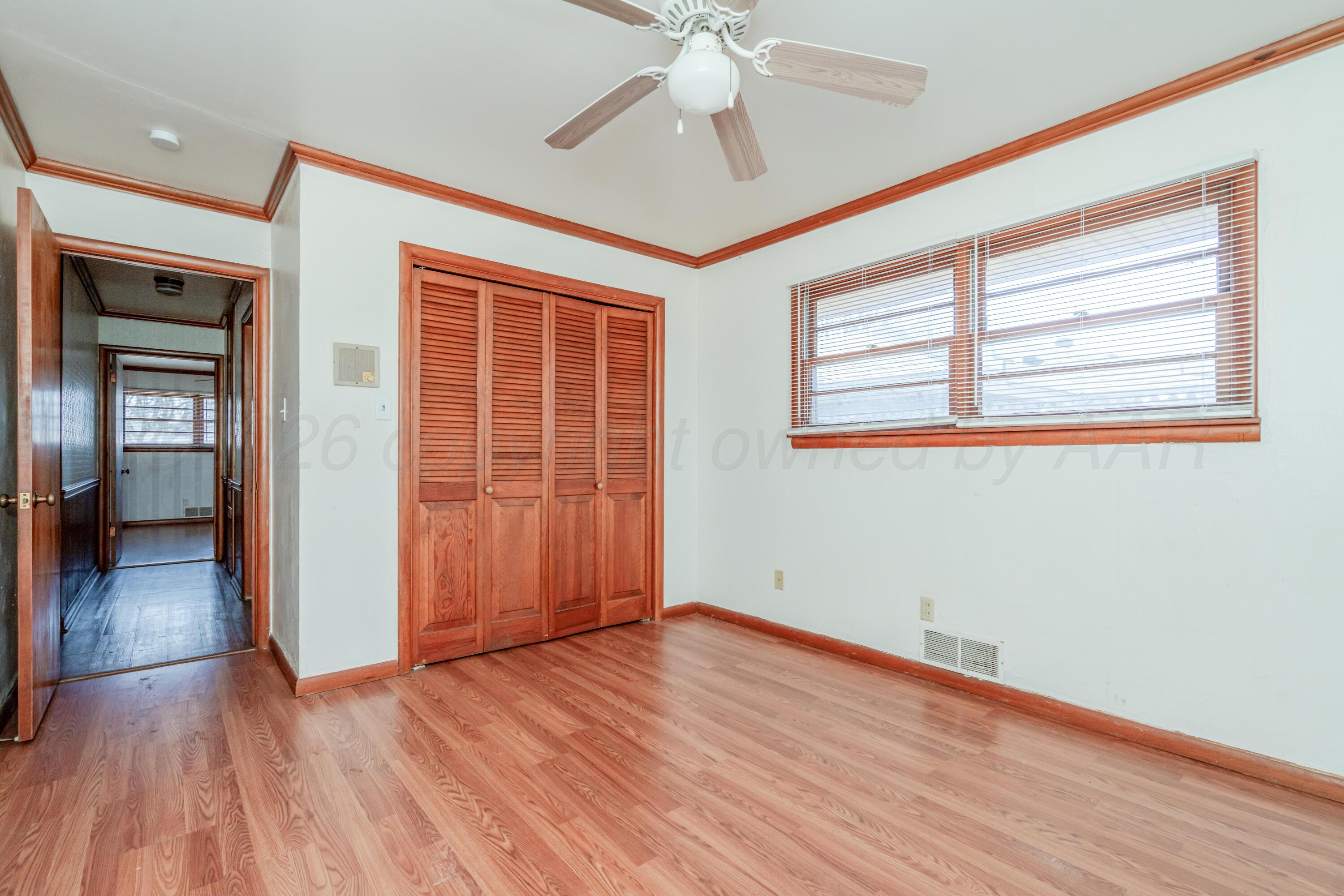 3308 Sunlite Street Amarillo, TX 79106 - Photo 24 of 37 wooden floor in an empty room with a window