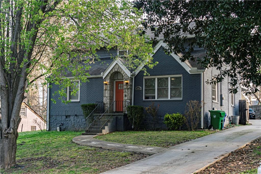 a front view of a house with garden