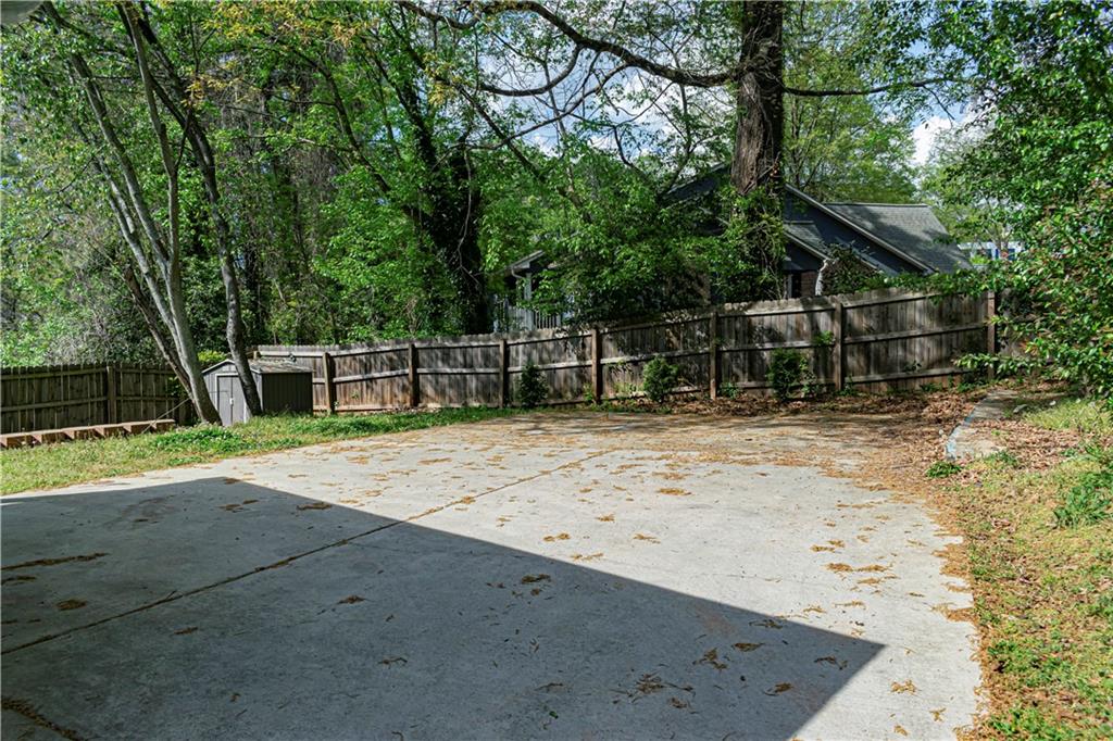 1892 Terry Mill Road Southeast Atlanta, GA 30316 - Photo 21 of 25 a view of a backyard with a large tree
