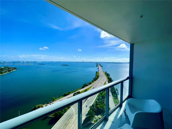 a view of a lake with a big yard