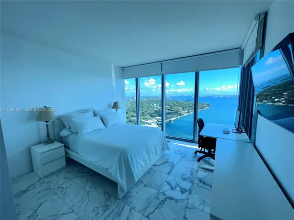 a bed room with a bed and a couch