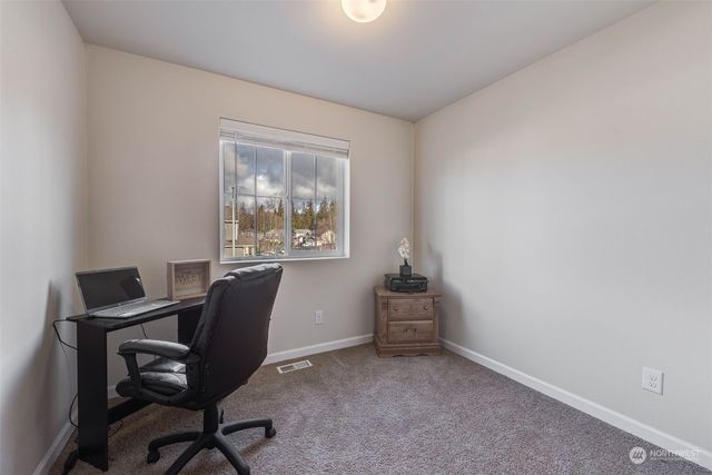 a view of a backyard of the house